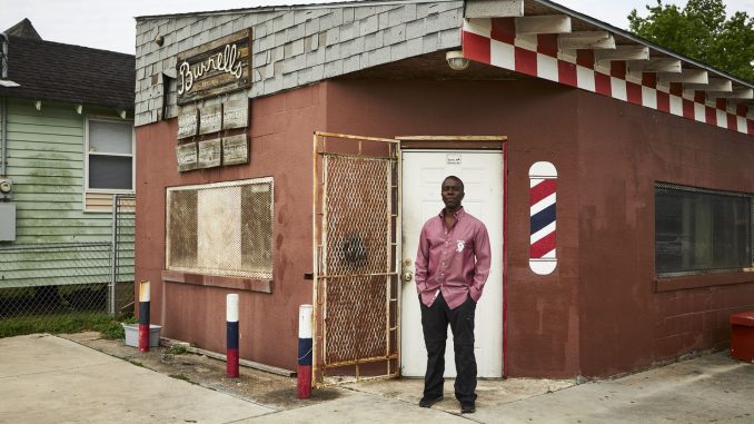 Burnell Cotlon in front of his store